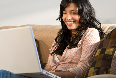 Woman with laptop on her lap