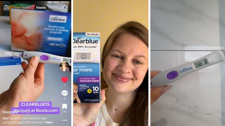 Cleablue Ovulation test with smiley face, Woman holding up Clearblue Ovulation test, hand showing Clearblue Ovulation test with smiley face