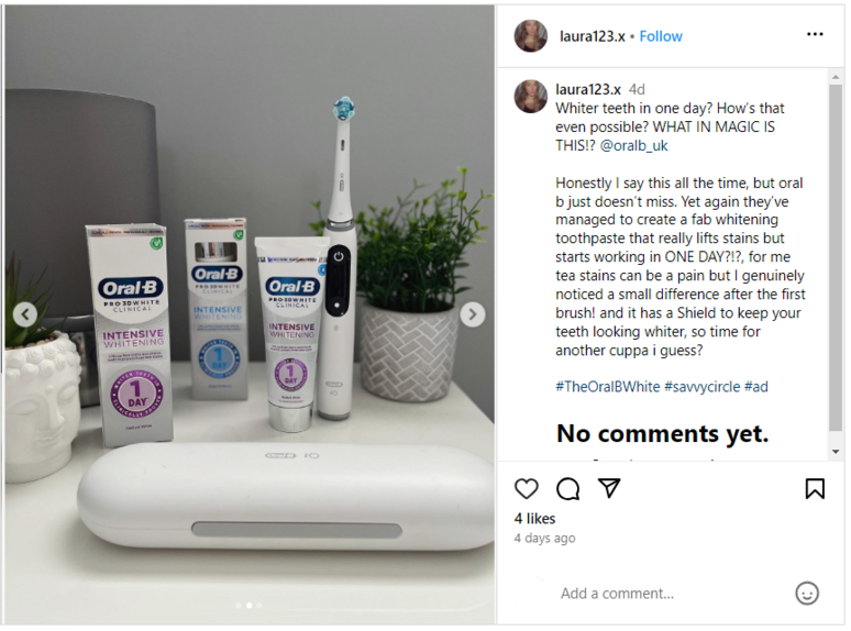 Oral-B tubes and Oral-B iO toothbrush standing on a table top with plants 