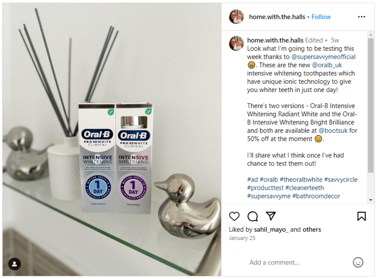 Oral-B tubes on a glass shelf with a silver duck